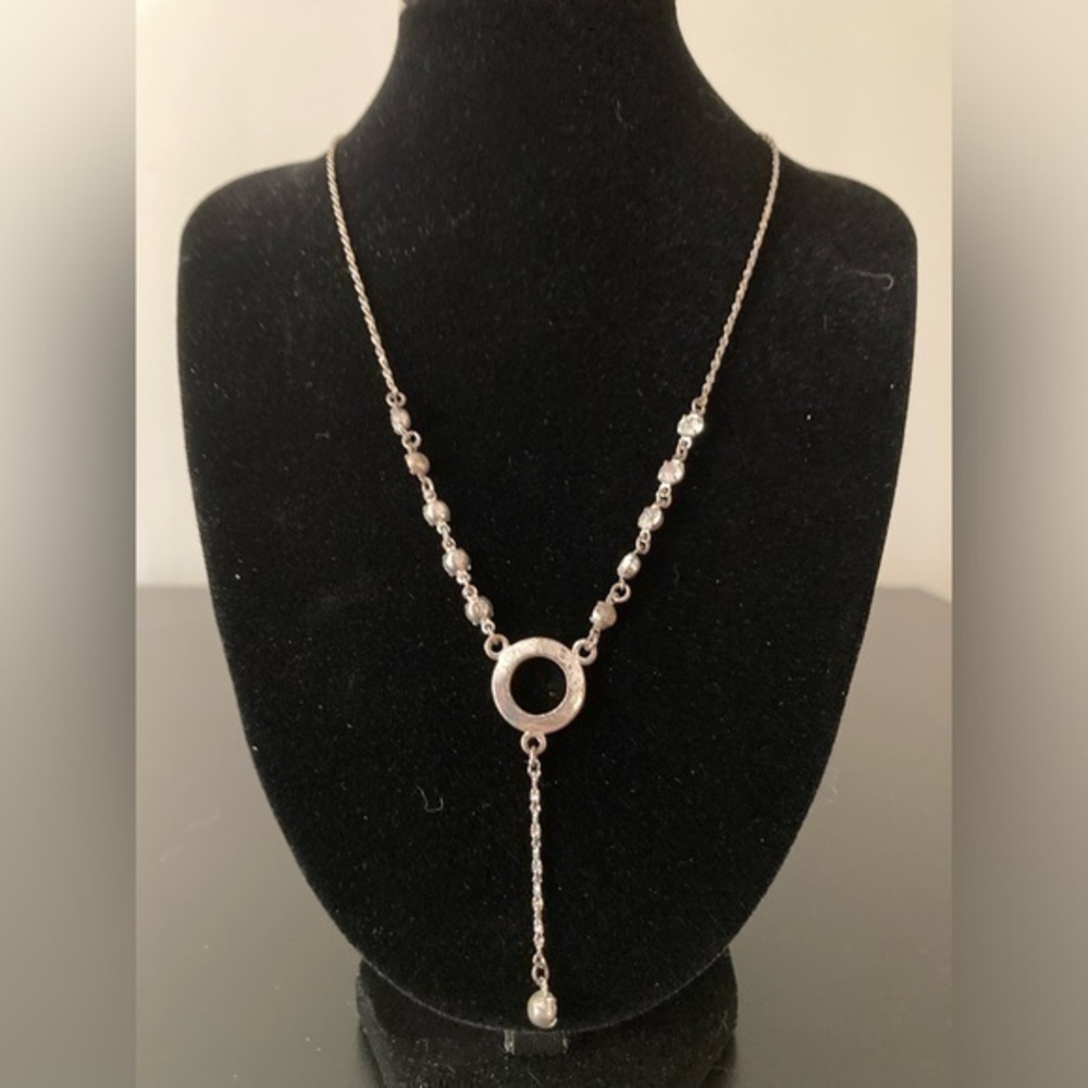 Icing necklace. Silver tone with rhinestones. Has some scratches.